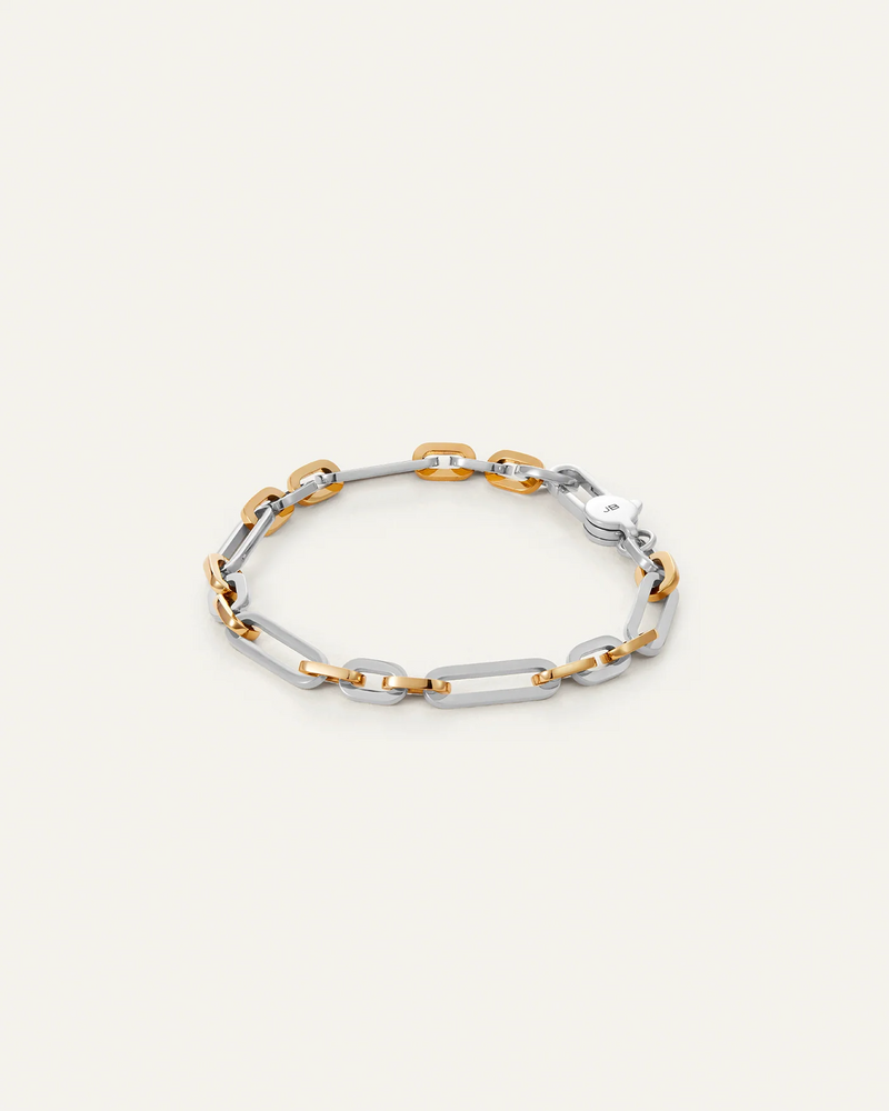 Jenny Bird Mercer Bracelet two-tone chain bracelet with silver and gold links on a light background.