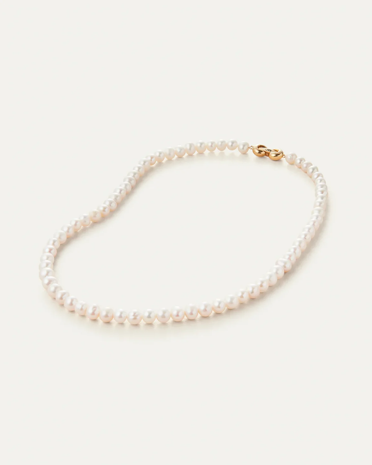 Jenny Bird Noa necklace freshwater pearl strand flat lay view Lemonberry Aurora

