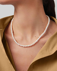 Jenny Bird Noa necklace freshwater pearl strand worn on model neck Lemonberry Aurora