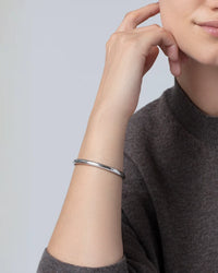 Jenny Bird Remi silver bangle front view on model Lemonberry Aurora