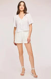 Gentle Fawn Jessa Top styled with white shorts and heels for a fresh summer look

