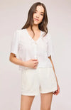 Close-up of Gentle Fawn Jessa Top featuring tie-front neckline and puff sleeves