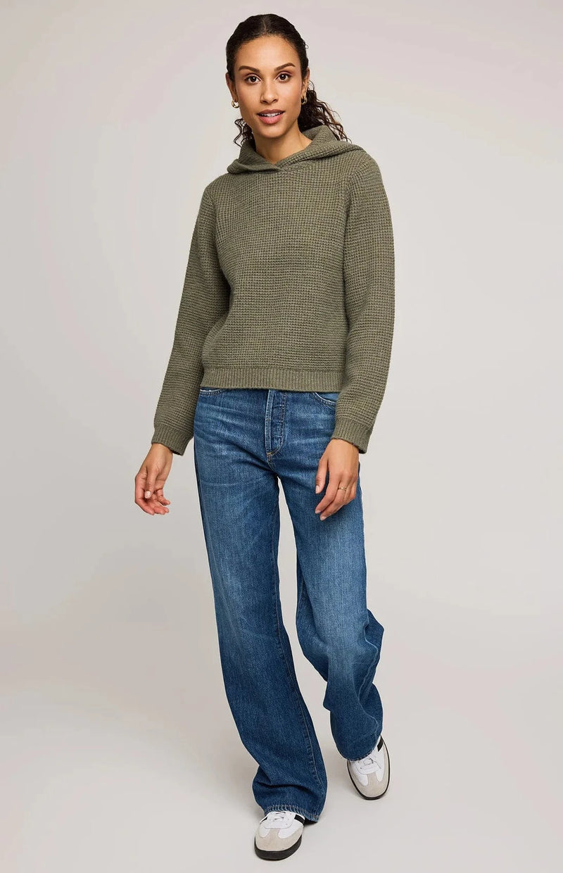 Full-length view, Gentle Fawn Jessica sweater in moss green paired with jeans and sneakers – Aurora