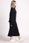 Side profile of Josie Skirt by Pink Martini in black, styled with black turtleneck sweater