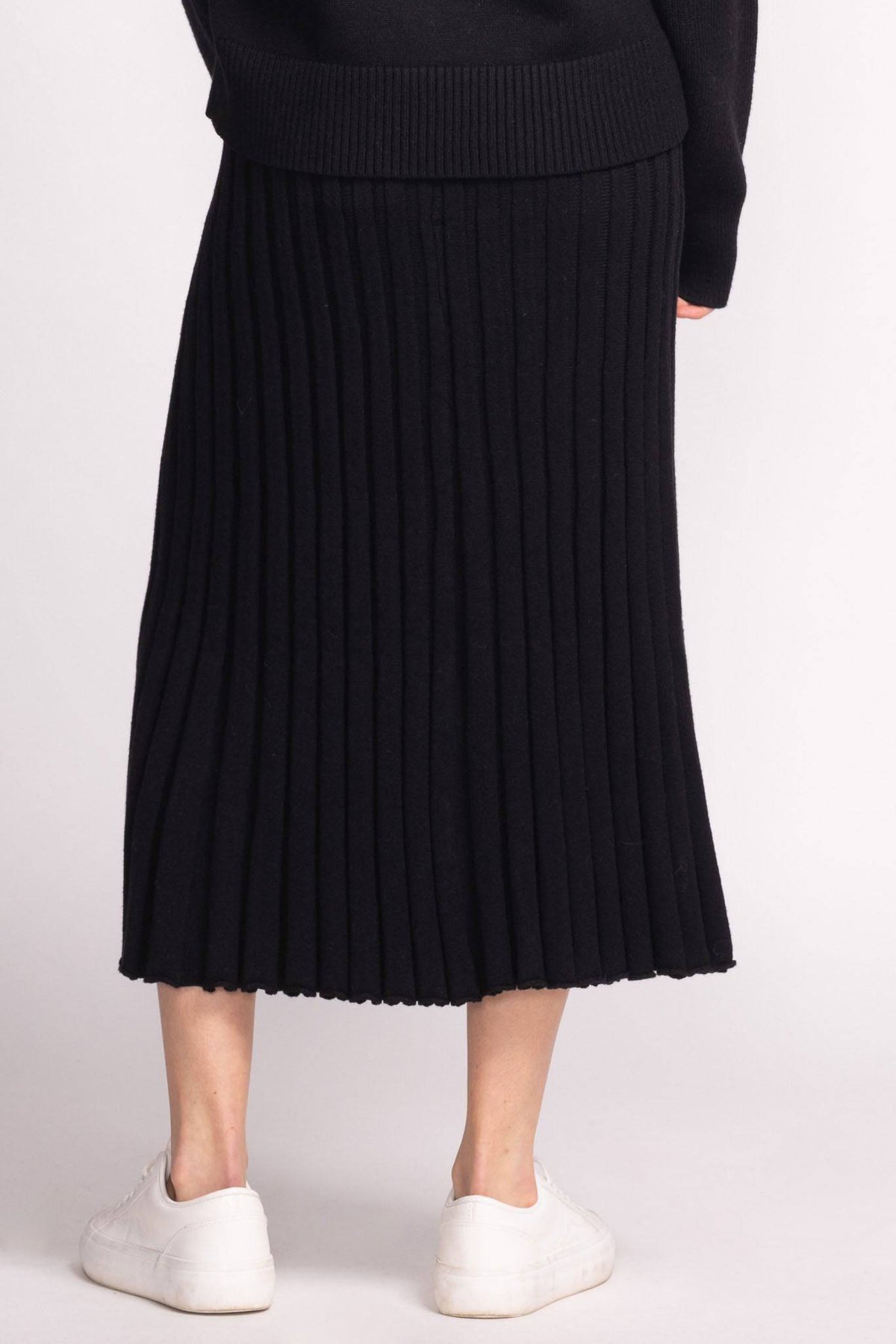 Back view of Josie Skirt by Pink Martini in black, pleated knit midi length