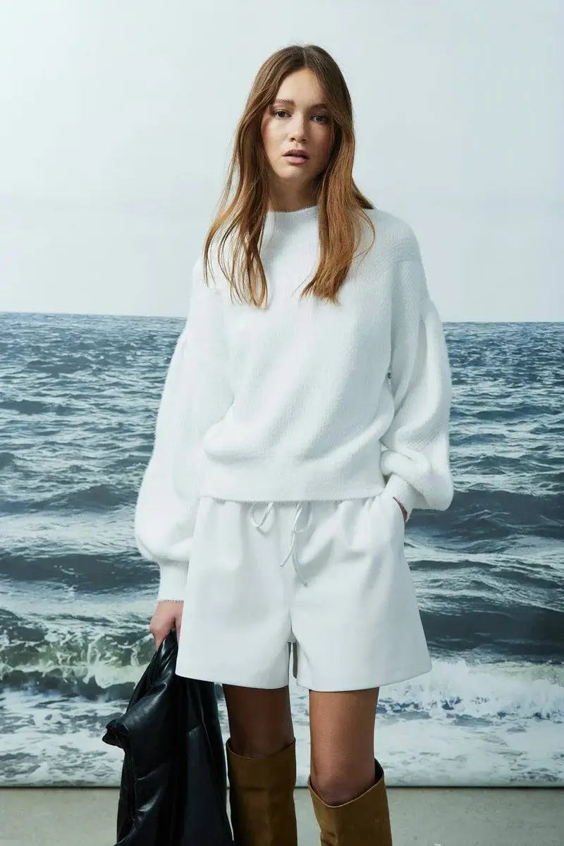 Joyela sweater by Melissa Nepton shown from the front in soft brushed knit, styled with white shorts.