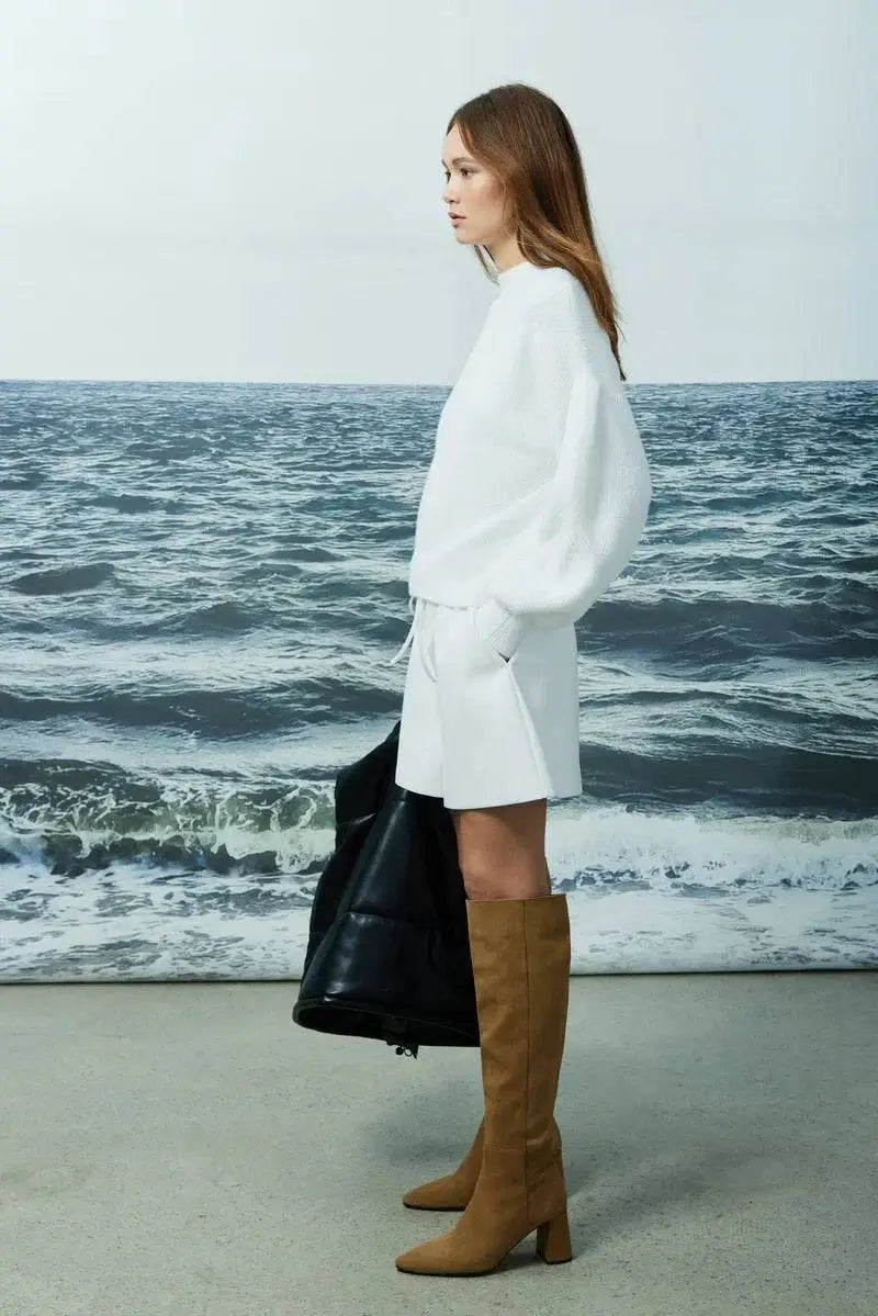 Side view of the Joyela sweater by Melissa Nepton highlighting the relaxed dolman sleeve and drop shoulder design.