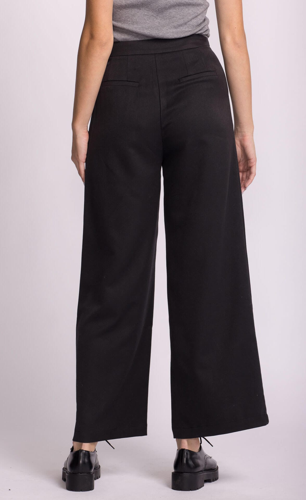 Wide leg Pink Martini Juna Pant, back view, black with welt pockets.