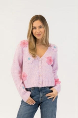 Lyla & Luxe Kailie flower cardigan in pink-purple with pastel 3D flowers, styled with jeans, available at Lemonberry