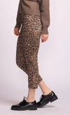 Close-up of leopard print trousers with stretch fit and pockets