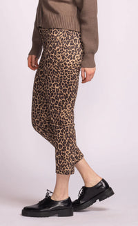 Close-up of leopard print trousers with stretch fit and pockets