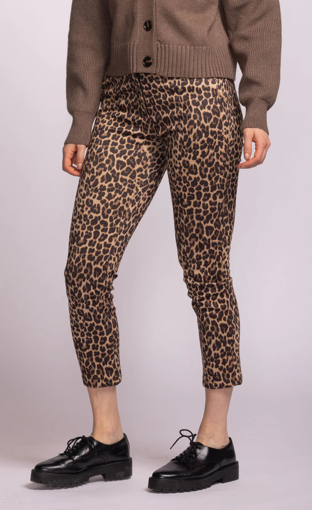 Side view of Kitty Pants showing fitted ankle silhouette and leopard pattern