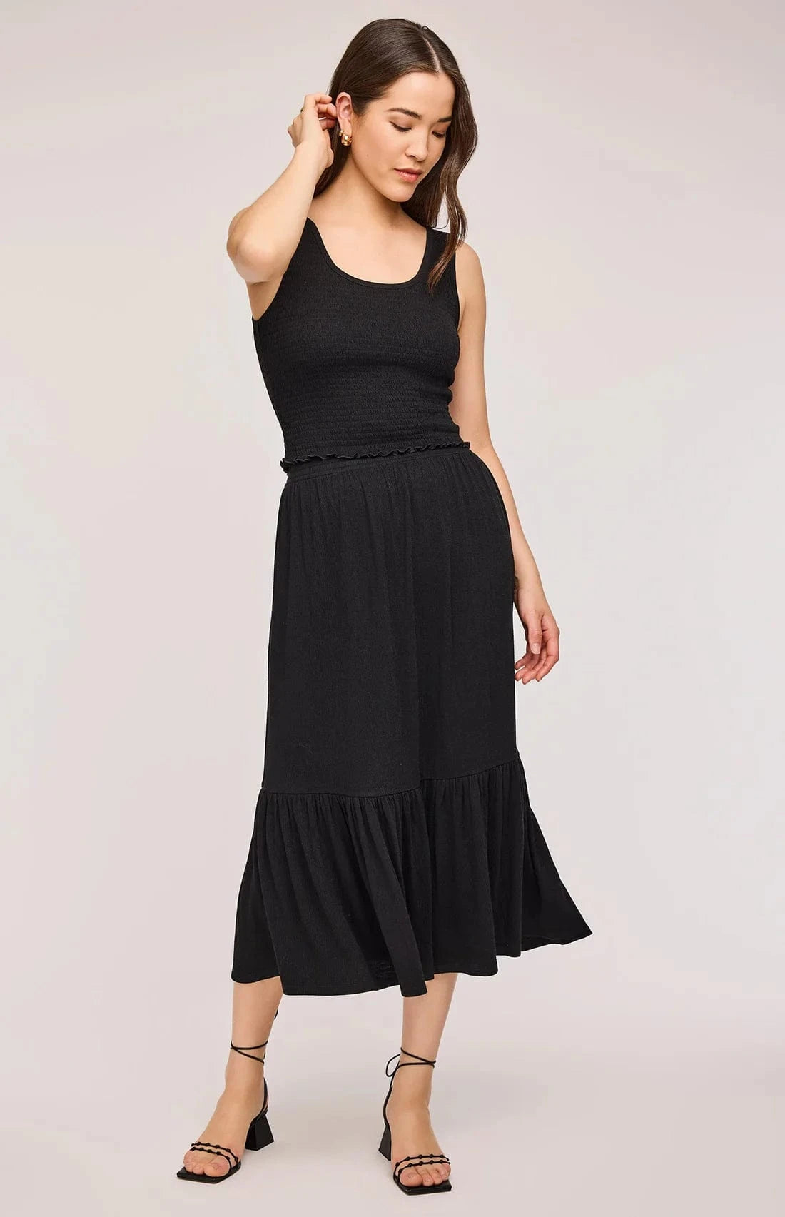 Full-body view of model wearing the Gentle Fawn Layla Tank and Elaine Skirt in black. A chic, coordinated set with a textured knit finish.