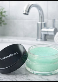 Lemonberry Signature Lip Scrub styled on a marble bathroom counter with modern sink, Lemonberry Aurora