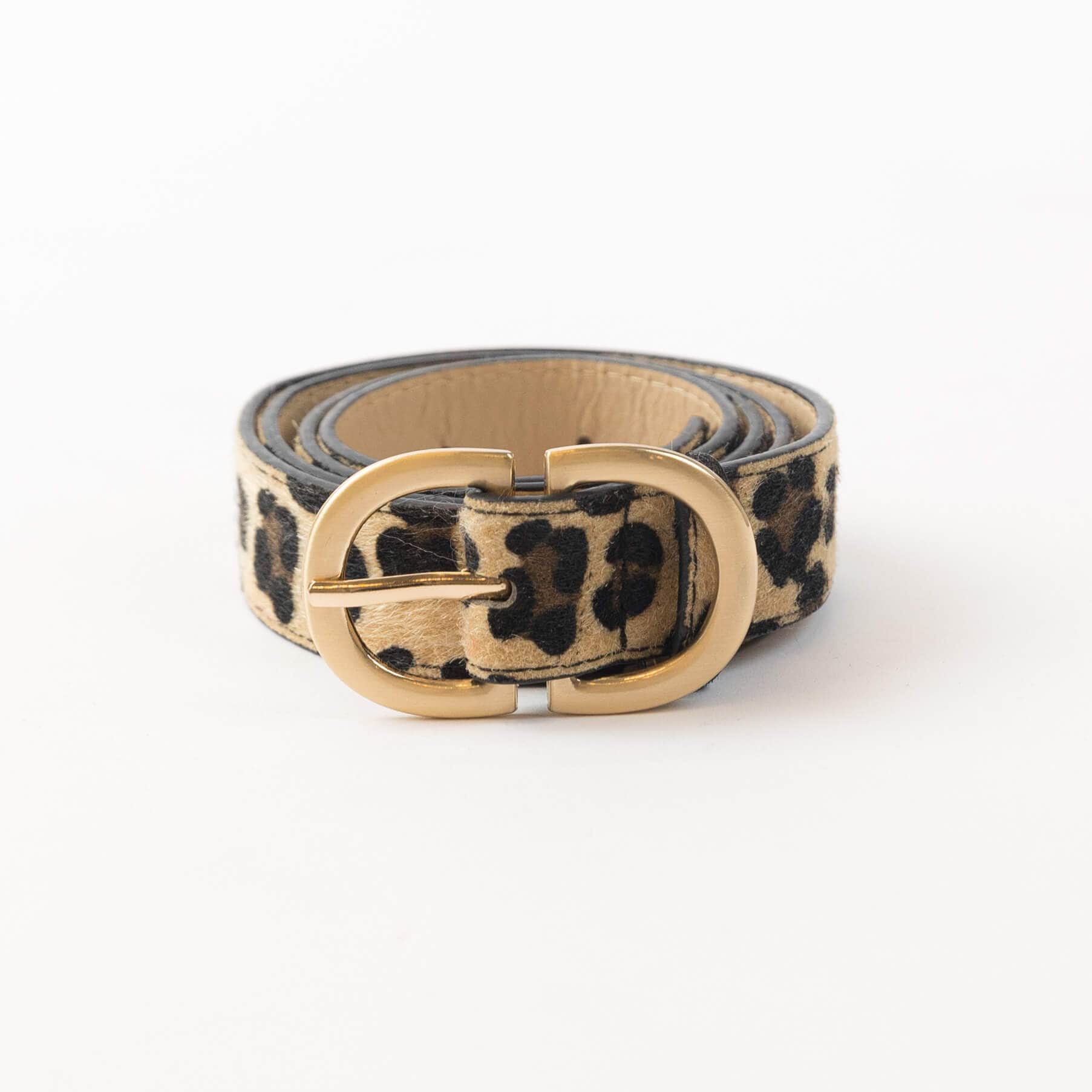 Lyla & Luxe Leo Belt in leopard-print faux calf hair with matte gold double-ring buckle, photographed on white background at Lemonberry.