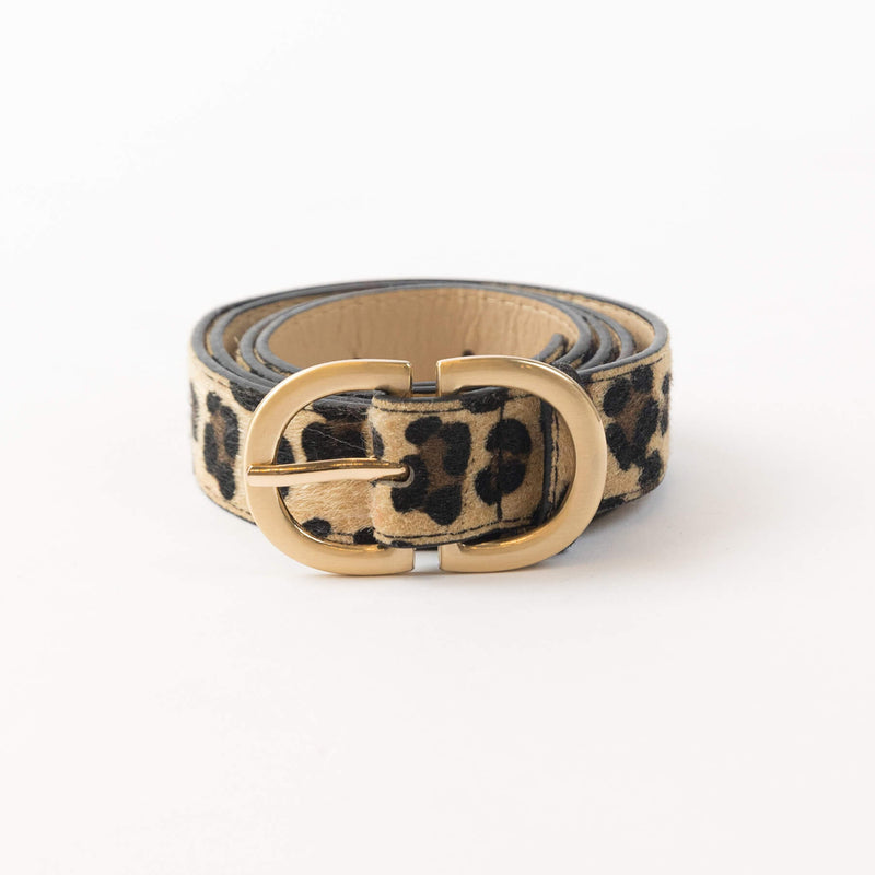 Lyla & Luxe Leo Belt in leopard-print faux calf hair with matte gold double-ring buckle, photographed on white background at Lemonberry.