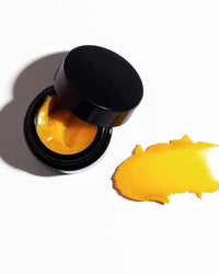 close up of Henné Organics lip mask in black jar for Lemonberry Aurora