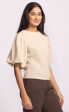 Side angle of Pink Martini Lita Top beige puff sleeve blouse.