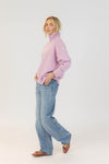 Full outfit: Lyla & Luxe Aggie pink mix sweater styled with light wash jeans and ballet flats