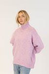 Lyla & Luxe Aggie pink mix sweater tucked into jeans for casual styling