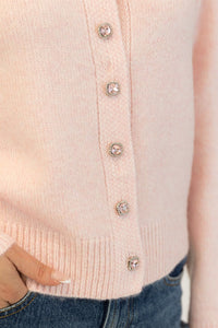 Close-up of crystal embellishments on Aisha Crystal pink sweater