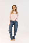 Styled look with Aisha Crystal sweater in pink paired with denim