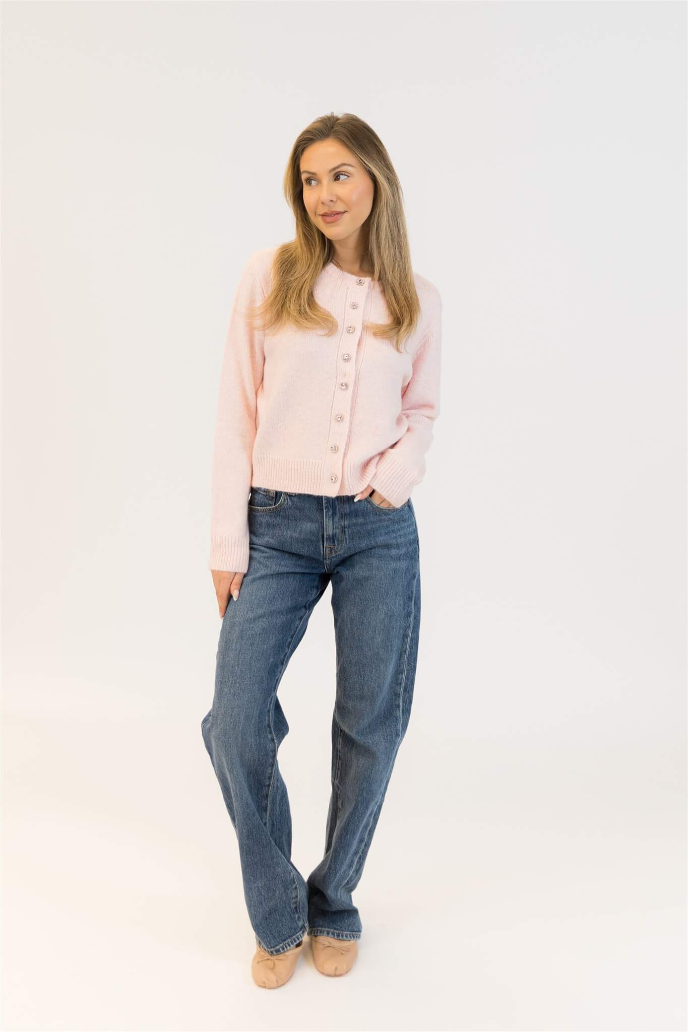 Styled look with Aisha Crystal sweater in pink paired with denim