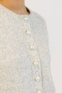 Close-up of pearl details on Aisha Pearl sweater in grey marl
