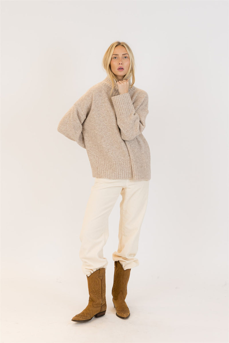 Lyla & Luxe Oliver Luxe eco mockneck sweater in light oat, styled with ivory cords and tan boots