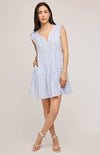 Super cute Maggie Mini Dress by Gentle Fawn in blue and white stripe, paired with white strappy sandals.