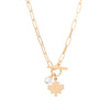 Isolated product shot of Maple Leaf Toggle Necklace in gold with pearl charm by Foxy Originals