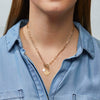 Gold Maple Leaf Toggle Necklace with pearl charm styled on model in chambray shirt – Foxy Originals Canadian jewelry