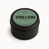 Market Candle Company Citrus and Cedar mini soy candle in a black tin with a sage green label