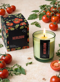 Market Candle Company Heirloom soy wax candle lit green glass with tomatoes and herbs lifestyle Lemonberry Aurora