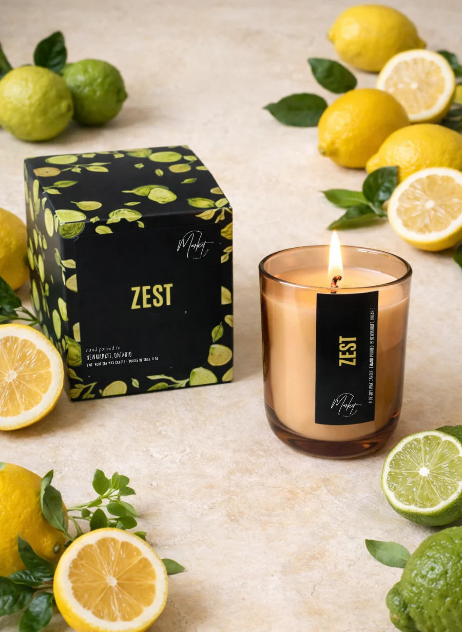 Market Candle Company Zest soy candle lit amber jar styled with lemons and limes Lemonberry Aurora