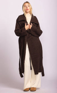 Model wearing Martha Sweater in dark brown by Pink Martini, long belted cardigan, styled over cream turtleneck