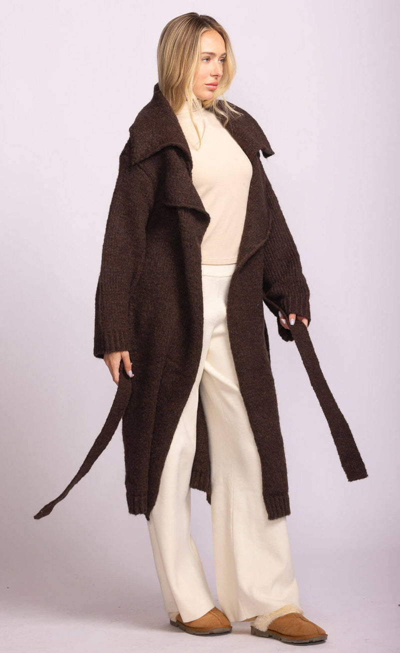 Side view of Martha Sweater in brown by Pink Martini, cozy longline knit with tie belt