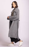 Side view of Martha Sweater in soft grey by Pink Martini, relaxed fit, layered with black pants