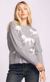 Side angle of the Meadow Sweater showing prancing horse print on soft grey knit.