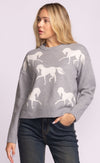 Front view of the Meadow Sweater by Pink Martini, grey knit with white horse pattern.