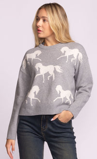 Front view of the Meadow Sweater by Pink Martini, grey knit with white horse pattern.