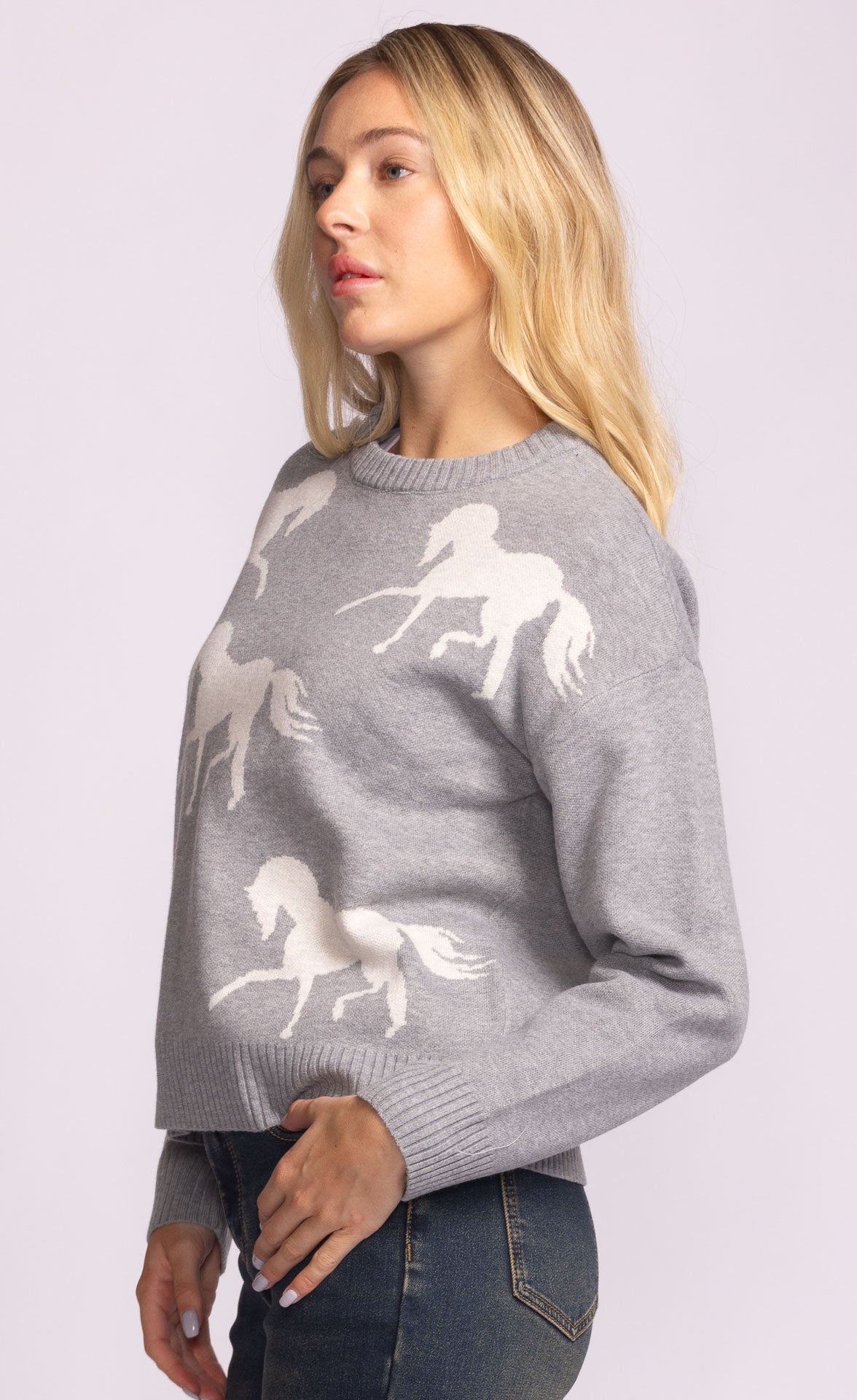 Close-up of the Meadow Sweater’s relaxed fit and equestrian-inspired design.