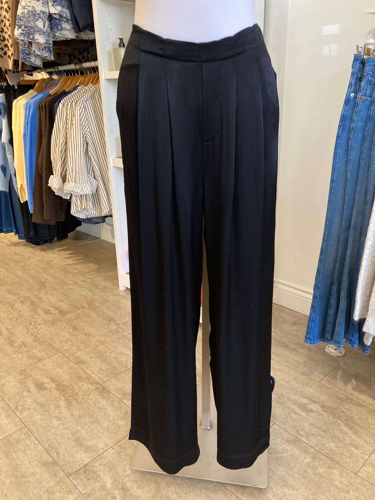 Close-up of Melissa Nepton Eileen Pant in black, pleated detailing, photographed at Lemonberry store