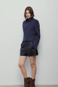 Melissa Nepton Elga navy turtleneck sweater styled with black shorts