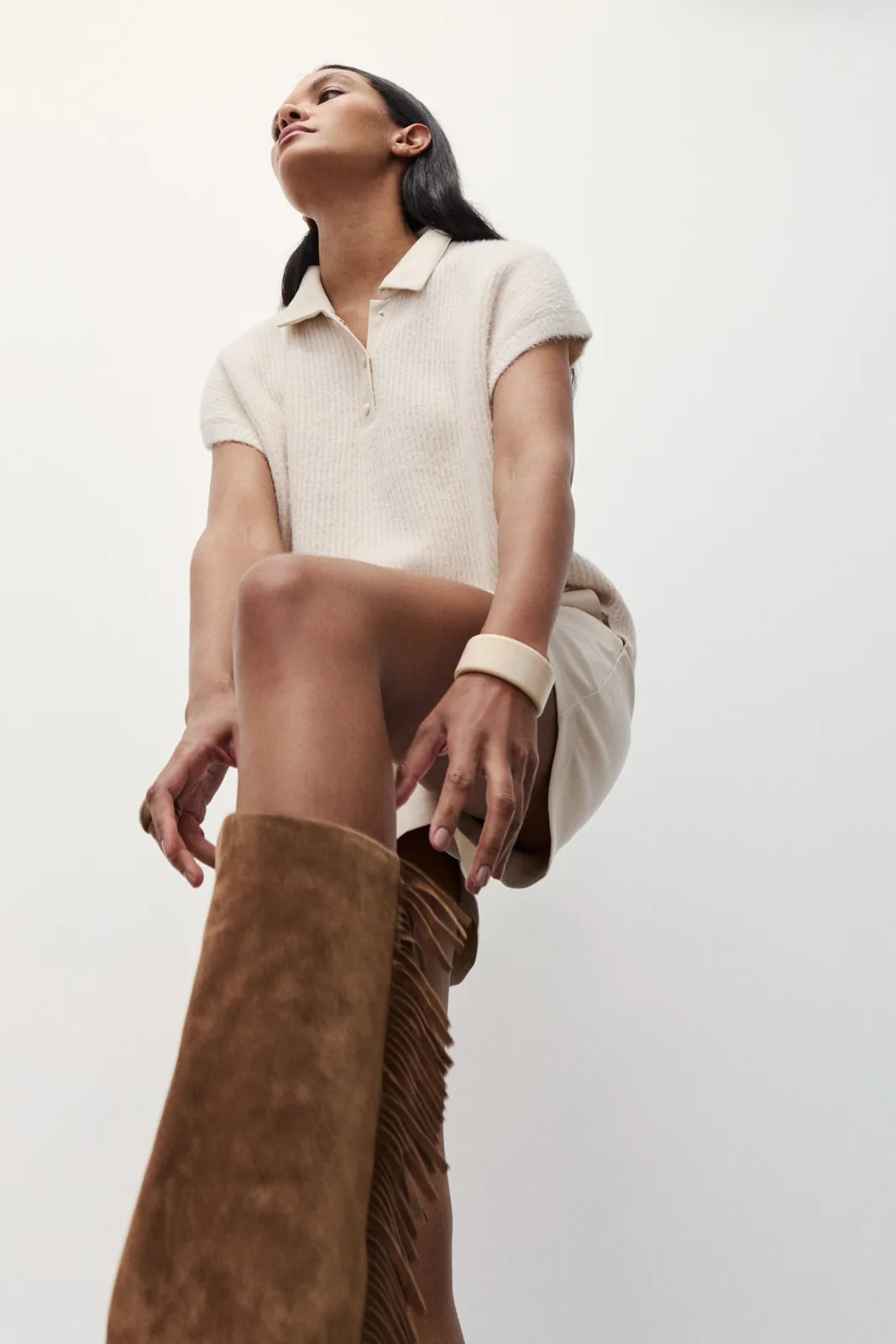 Melissa Nepton Lydie cream short sleeve polo sweater styled with boots