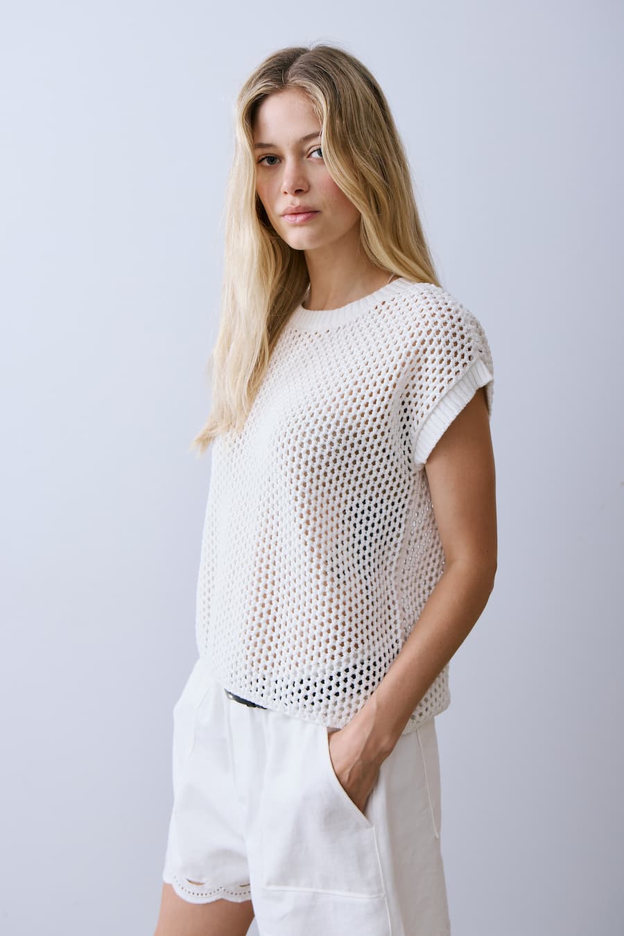 Another side view of Melissa Nepton Nolan open knit off white short sleeve top
