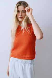 Melissa Nepton River sleeveless knit in Red with textured open stitch detail, styled with light blue trousers at Lemonberry Aurora