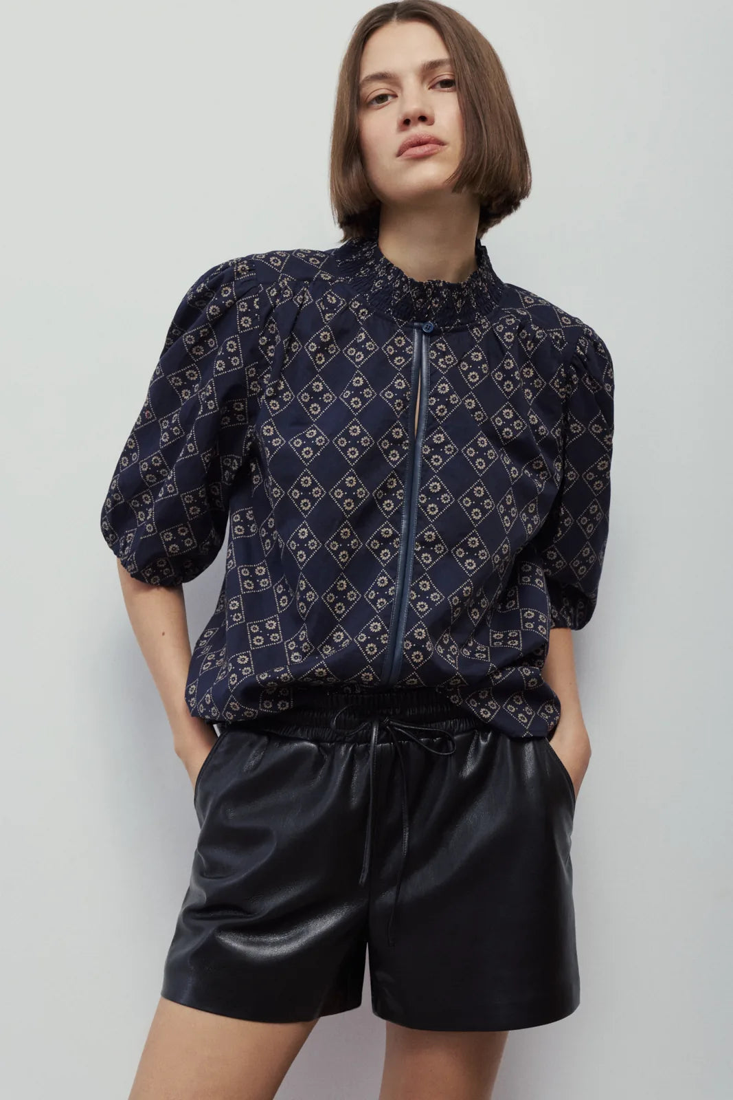 Melissa Nepton Xena navy printed puff sleeve blouse with black shorts