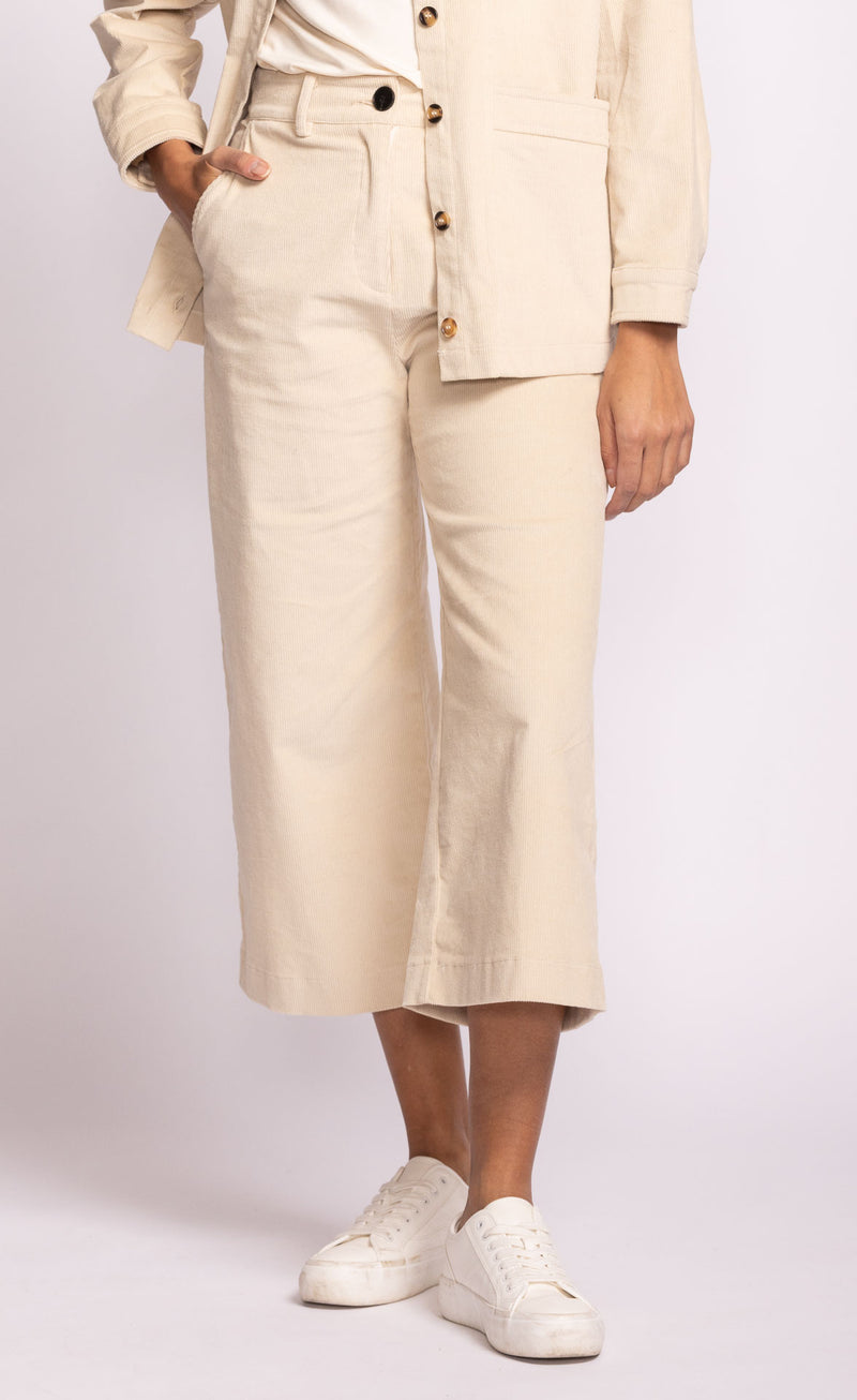 Pink Martini Midge Pants in cream corduroy, cropped wide-leg, styled with sneakers – available at Lemonberry Aurora