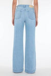 Rear view of Modern Dojo Trouser Jean by 7 For All Mankind, women’s wide leg flare denim in Trendsetter blue wash with clean finish and signature pocket detailing available at Lemonberry Aurora.